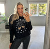 Champagne Clinking Christmas Jumper In Black